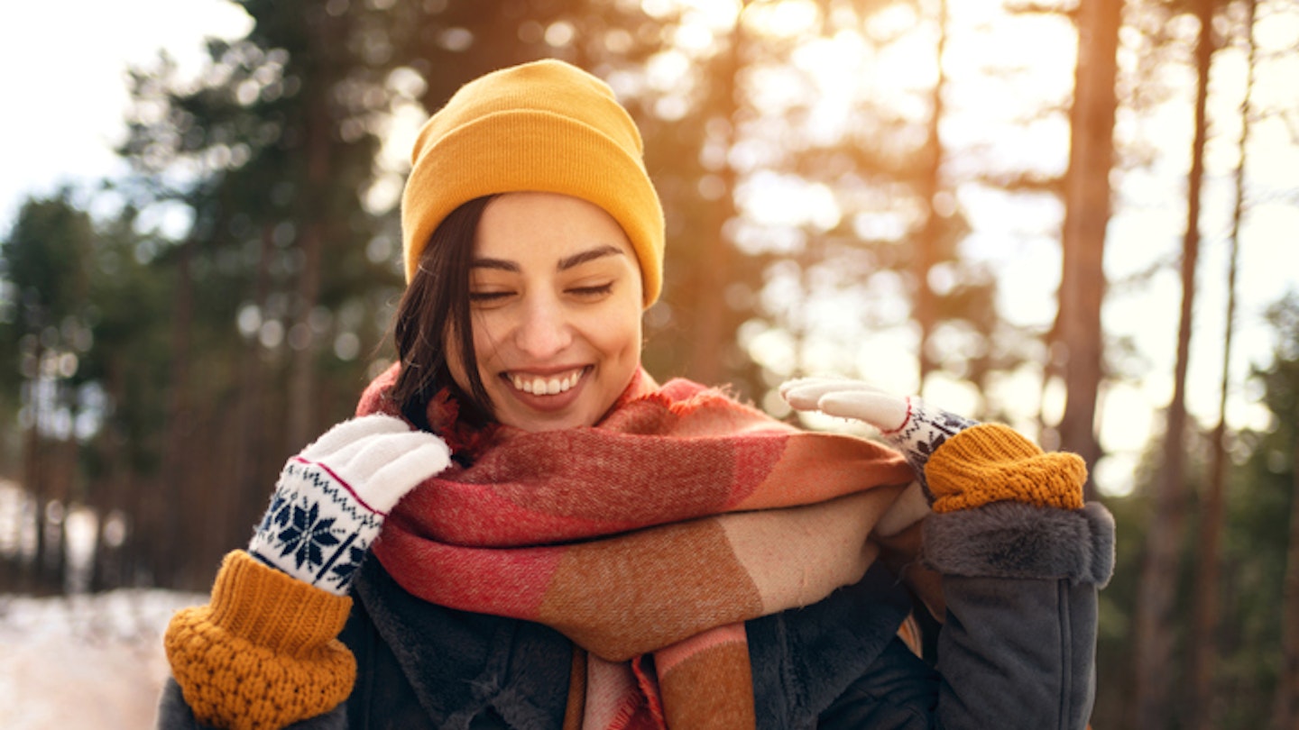 Happy woman walking winter